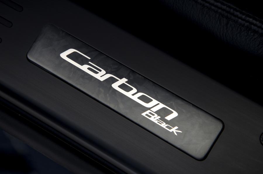 Логотип Aston Martin Vanquish Carbon Black 2014 года  (фото 19 из 30)